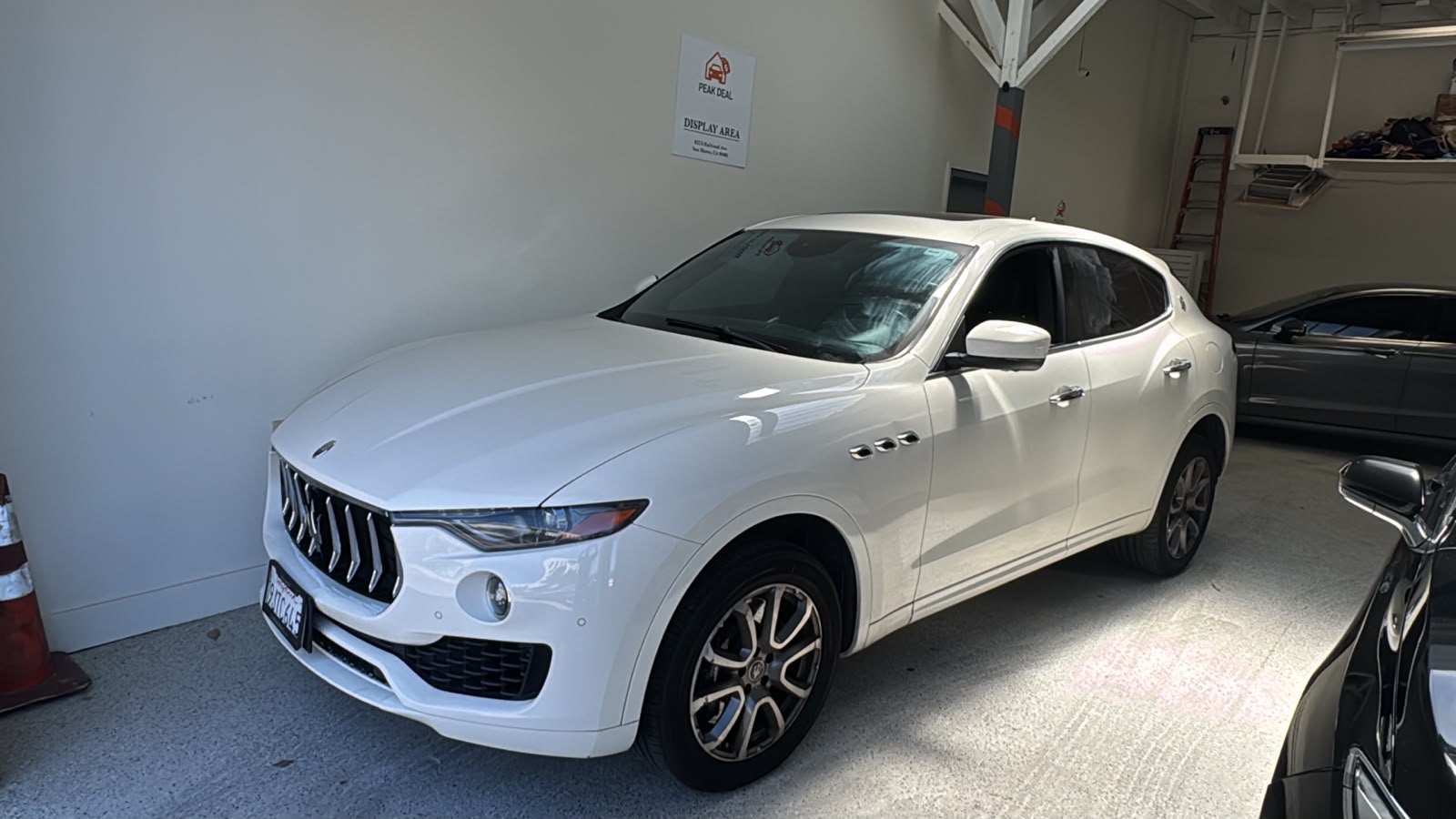 White 2020 Maserati Levante S SUV in the PeakDeal Auto Sales display area